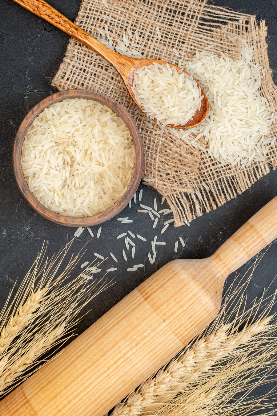 Top view of a rice bowl with wooden spoon
